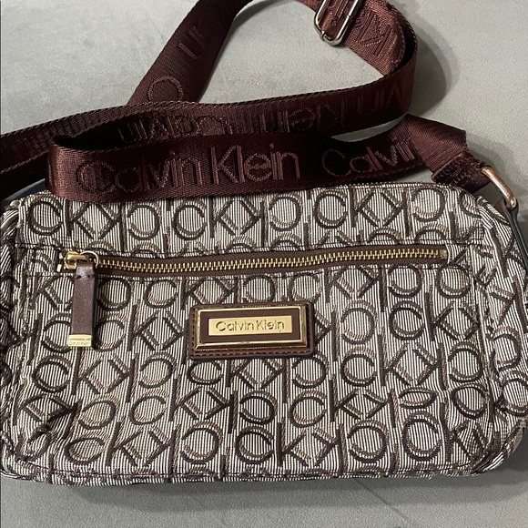 Calvin Klein Handbags - Calvin Klein Monogram Crossbody Bag in Brown and Gold